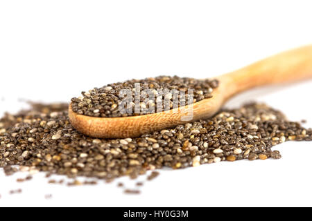 Close up chia seeds in wooden spoon on white background Stock Photo