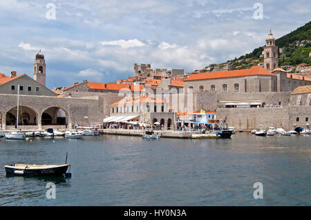 DUBROVNIK, CROATIA - JUNE 28, 2010: Locals and tourists are are arrived by the boat to Dubrovnik Stock Photo