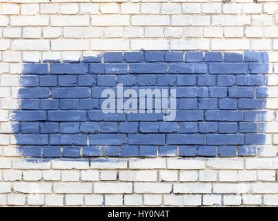 The old walls are painted with white paint and the selected fragment is painted with blue paint. Stock Photo