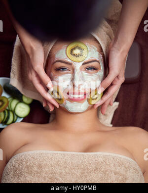 young woman with natural mask on face Stock Photo