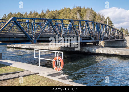 The Brighton swing bridge over Murray Canal on county road 64 near Brighton Ontario Canada. Stock Photo