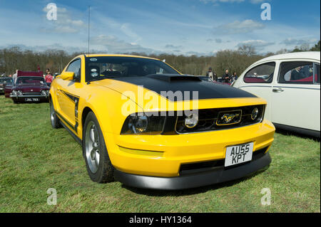 Farnborough, UK - April 6, 2012: Brilliant yellow Ford Mustang muscle car on display at the annual Wheels Day auto and bike show in Farnborough, UK Stock Photo