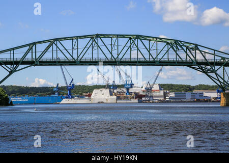 USS Zumwalt alongside at Bath Ironworks and framed by the Max L. Wilder Memorial Bridge Stock Photo