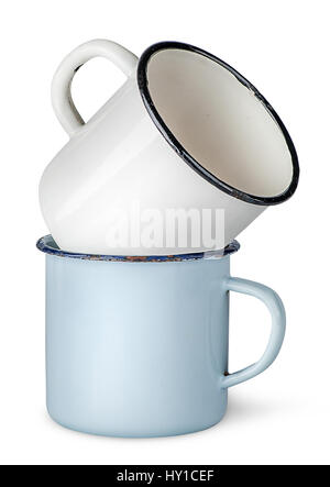 Two old enameled mugs on each other isolated on white background Stock Photo