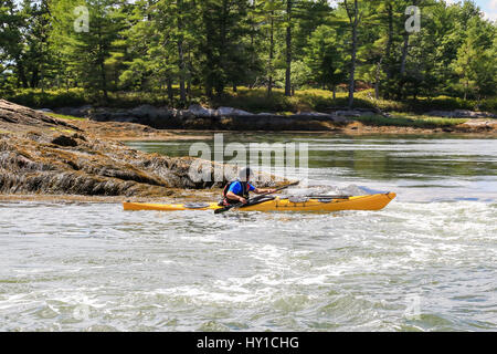 Kayaking in the rapid current of Lower Hell Gate Stock Photo