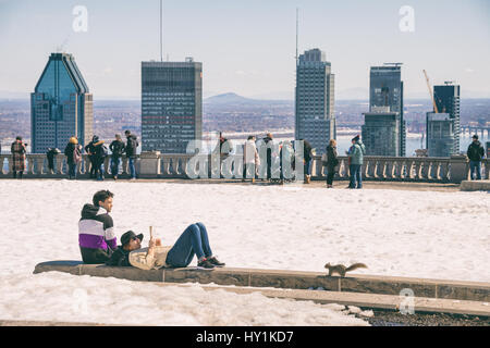Montreal, CA - 30 March 2017: People enjoying a sunny spring day on Kondiaronk Belvedere Stock Photo