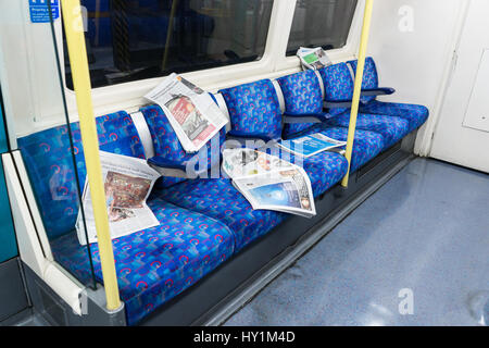 Newspapers left on the tube - London, UK Stock Photo