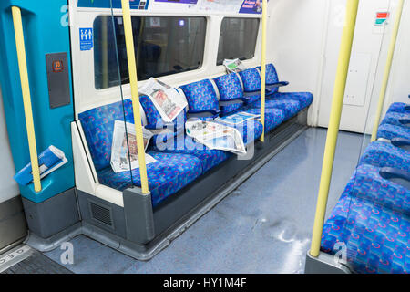 Newspapers left on the tube - London, UK Stock Photo