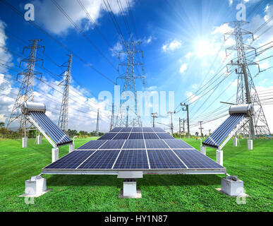 Solar energy panels and Vacuum solar water heating system against sunny sky Stock Photo