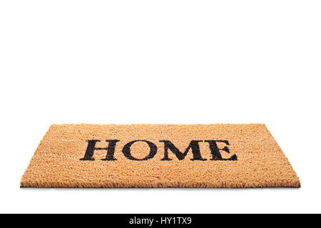Doormat with the word home written on it isolated on white background Stock Photo