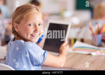 Girl using digital tablet at school Stock Photo