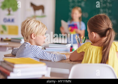 Rear view of best mates in the classroom Stock Photo