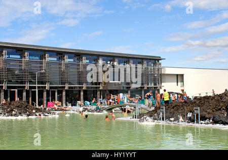 Stock Photo of locals and tourists enjoying the public swimming pool at the Blue Lagoon in Iceland. Stock Photo