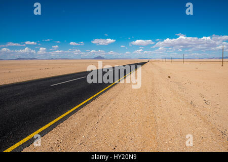 vibrant image of highway and blue cloudy sky