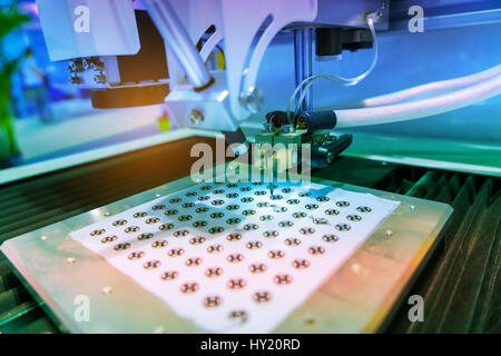 Robotic arm at production line in factory Stock Photo