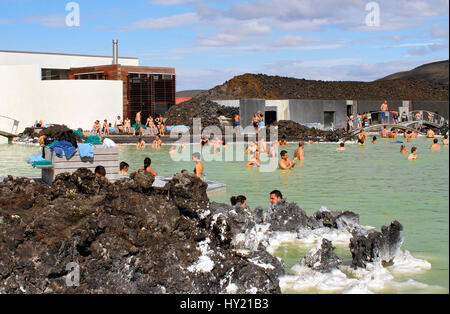 Stock Photo of locals and tourists enjoying the public swimming pool at the Blue Lagoon in Iceland. Stock Photo