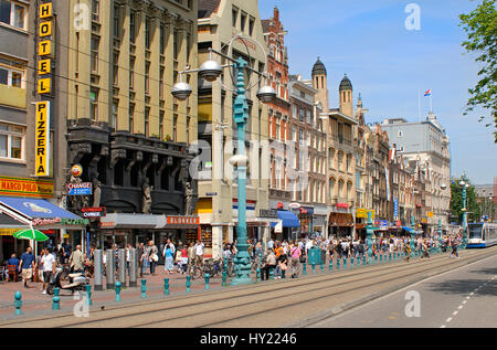 Image of the Damrak shopping street in the inner city of Amsterdam, Holland. Stock Photo