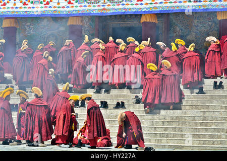 An Assembly Of Tibetan Monks In Front Of The Main Temple Of Labrang Monastery In Xiahe, Gansu Province, China