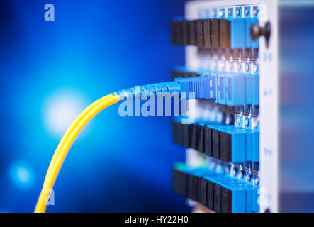 fiber optic telecommunication cables on blur background Stock Photo