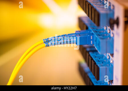fiber optic telecommunication cables on blur background Stock Photo