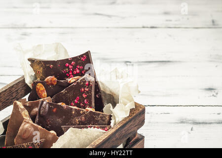 Variety of chocolate bars in wooden box Stock Photo
