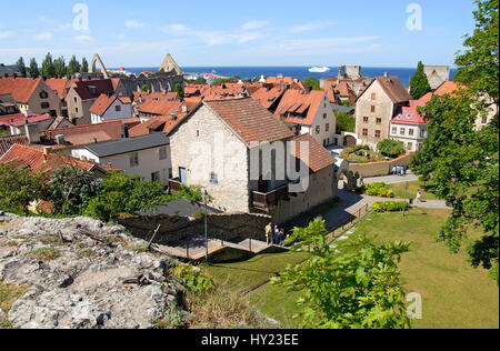 The Stock Photo shows a view over the red roofs of the Harbor town of Visbyon the Island of Gotland in Sweden. The image was taken from the top of the Stock Photo