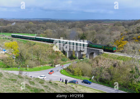 Corfe Castle, Dorset, UK. 31st Mar, 2017. The Swanage Railway hosting a steam gala over 3 days with Bulleid locomotives to celebrate the 50th anniversary of the final operation of steam hauled service on British Railways Southern Region. Pictured is the locomotive 34081 92 Squadron crossing the viaduct before Corfe Castle station. Photo Credit: Graham Hunt/Alamy Live News Stock Photo