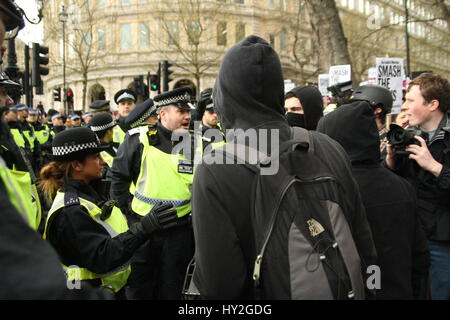 London, UK. April 1st, 2017. Police confront anti-racist protesters. Far right groups Britain First and the English Defence League (EDL) Hold a rally in Whitehall, drawing on the recent terrorist attack in nearby Westminster as a justification. A counter 'unity demo' is held by Unite against Facism (UAF). Credit: Roland Ravenhill/Alamy Live News Stock Photo