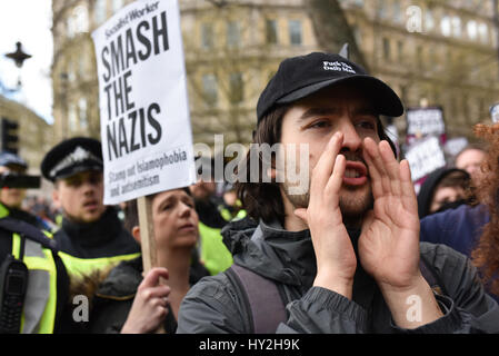 London, UK. 1st Apr, 2017. Anti-fascist demonstrators chant during a counter demonstration against a right wing march through London. Far-right groups Britain First and the EDL took to the streets in central London to protest in response to the recent Westminster terror attack. Credit: Jacob Sacks-Jones/Alamy Live News.