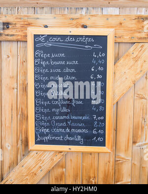 Crepes menu handwritten on blackboard outside a french restaurant Stock Photo