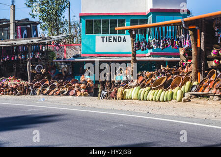 Market with 'Tienda' (Store) on outer wall with bowls, handmade goods, and other items for sale. Stock Photo