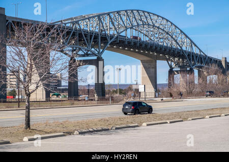 The Burlington Skyway a multi vehicle highway bridge that spans the narrow entrance at Burlington Bay and Lake Ontario. Stock Photo