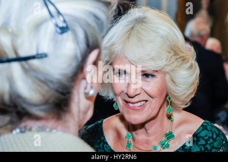 HILLSBOROUGH, NORTHERN IRELAND. 24 MAY 2016: The Duchess of Cornwall chats to a guest in Hillsborough Palace.