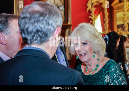 HILLSBOROUGH, NORTHERN IRELAND. 24 MAY 2016: The Duchess of Cornwall chats to guests in Hillsborough Palace.