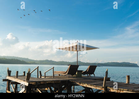 Beach Chairs and Umbrella on island in Phuket, Thailand. Summer, Travel, Vacation and Holiday concept Stock Photo