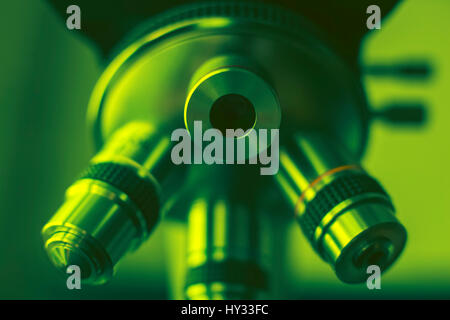 Laboratory Equipment - Optical Microscope. Photo of a medical microscope close-up. Green tone. Stock Photo