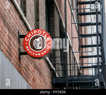New York, December 08: Sign above one of the Chipotle mexican fast food restaurants in Manhattan. Stock Photo