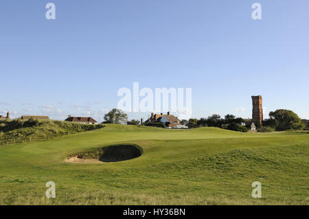 View over small bunker to the 17th Green and water tower, Littlestone golf course, Littlestone, Kent, England Stock Photo