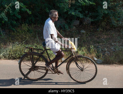 Old man riding a push bike in Koonthankulam, Tamil Nadu,India, Stock Photo