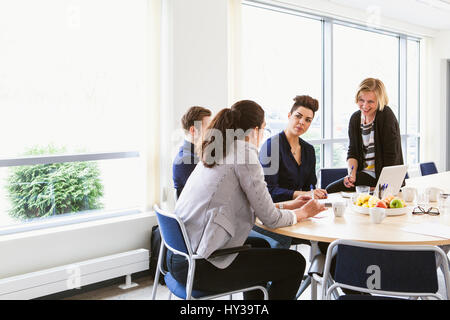 Sweden, Young people sharing ideas during board meeting