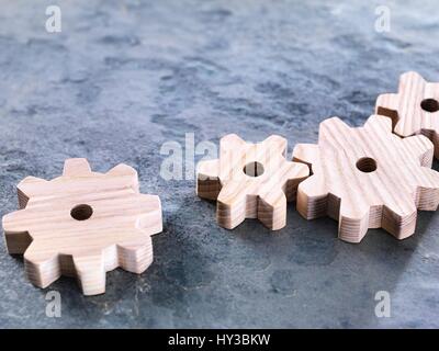 Interlocking wooden cogwheels. Stock Photo