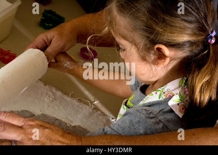 little girl cooking in kitchen Stock Photo