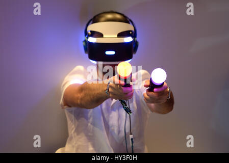 BARCELONA - JUN 16: A man tries the Playstation VR (Virtual Reality) glasses at Sonar Festival on June 16, 2016 in Barcelona, Spain. Stock Photo