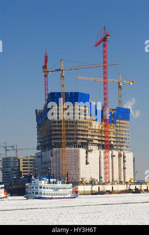 Bicycle steamboat Louisiana star and building site in the Elbphilharmonie in winter, Hamburg, Germany, Raddampfer Louisiana Star und Baustelle an der  Stock Photo