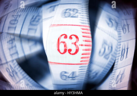 Dimension tape with the number 63, symbolic photo pension with 63, Maßband mit der Zahl 63, Symbolfoto Rente mit 63 Dimension tape with the number 63, symbolic photo pension with 63, Maßband mit der Zahl 63, Symbolfoto Rente mit 63