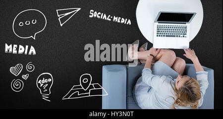 Woman on her laptop against black background Stock Photo