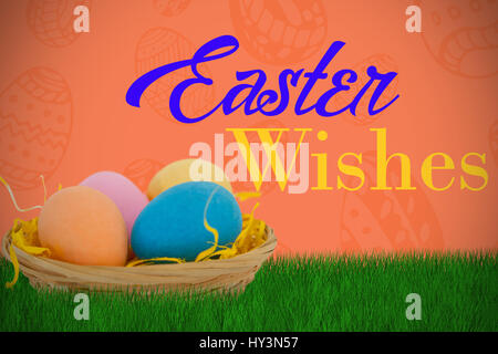 Colorful Easter eggs in wicker basket  against red background Stock Photo