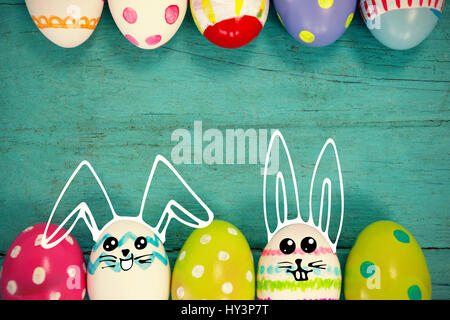 PE047 butterfly 02 bs nf against various easter eggs arranged on wooden surface Stock Photo