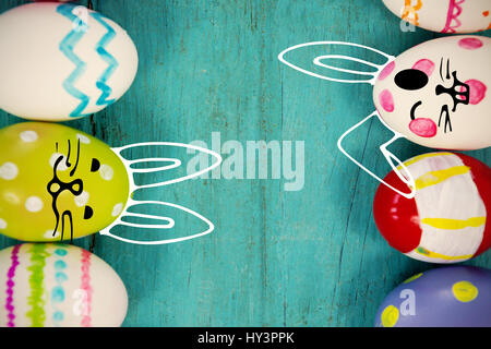 PE047 butterfly 02 bs nf against various easter eggs arranged on wooden surface Stock Photo