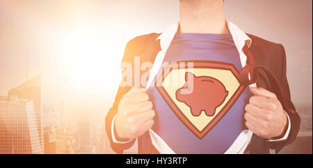 MIdsection of businessman opening shirt in superhero style against misty cityscape Stock Photo